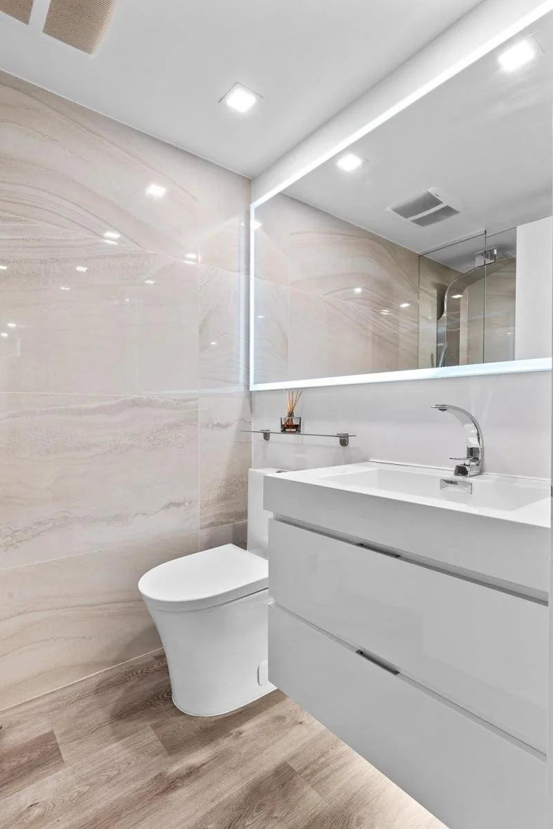 Modern bathroom remodel with floating vanity and backlit mirror — Vancouver bathroom renovation